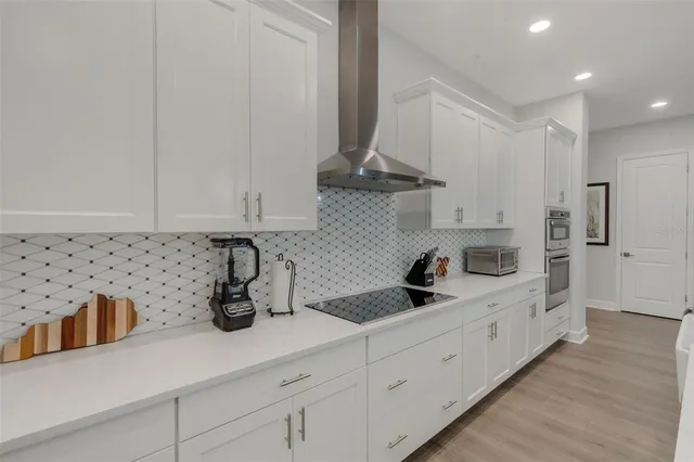 a bedroom with a bed and glass door
