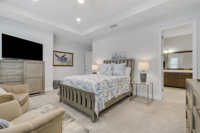 a view of a livingroom with furniture and a flat screen tv