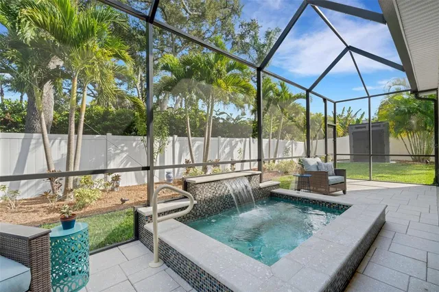 a living room with hard wood floors and a flat screen tv