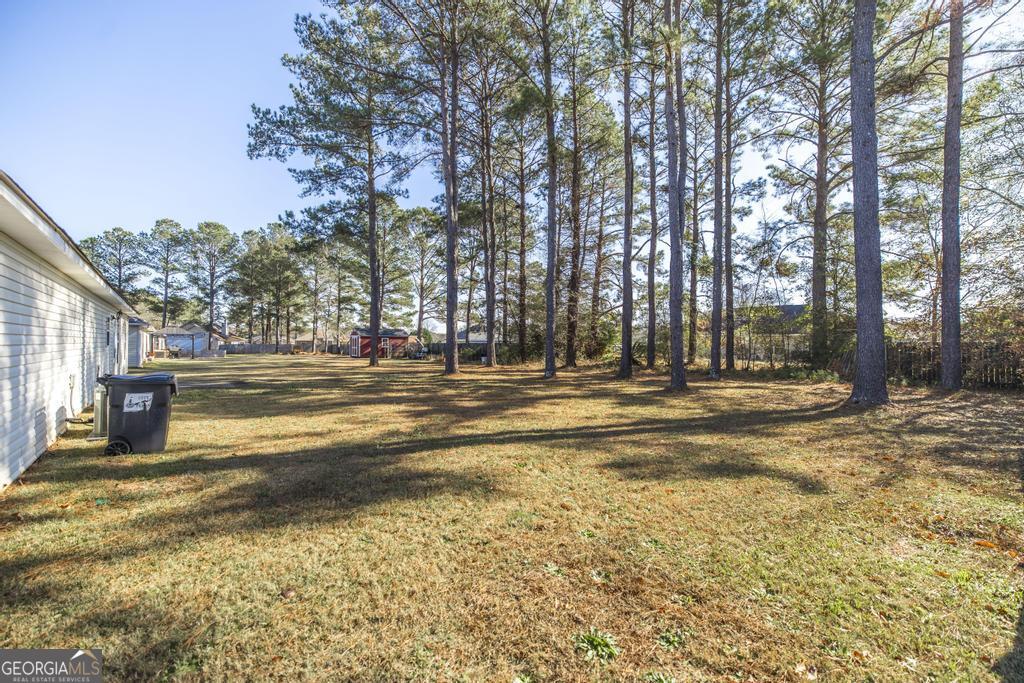 204 Chimney Rock Road Perry, GA 31069 - Photo 28 of 28 a view of a building with trees in the background