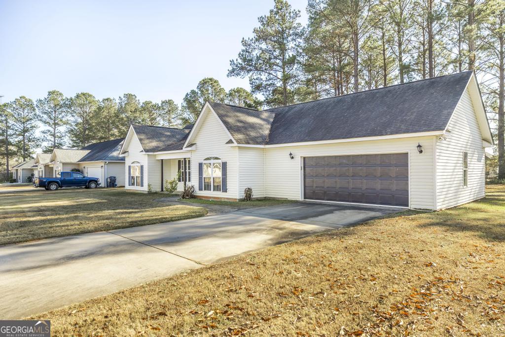 204 Chimney Rock Road Perry, GA 31069 - Photo 4 of 28 a view of street along with house and trees