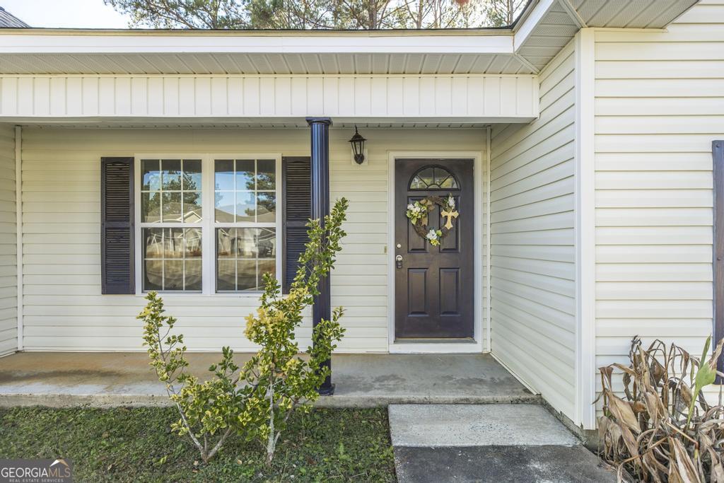 204 Chimney Rock Road Perry, GA 31069 - Photo 5 of 28 a front view of a house with a yard