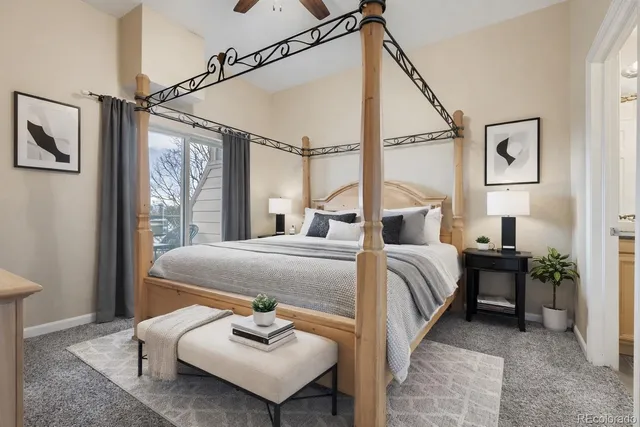 a bedroom with a bed and ceiling fan