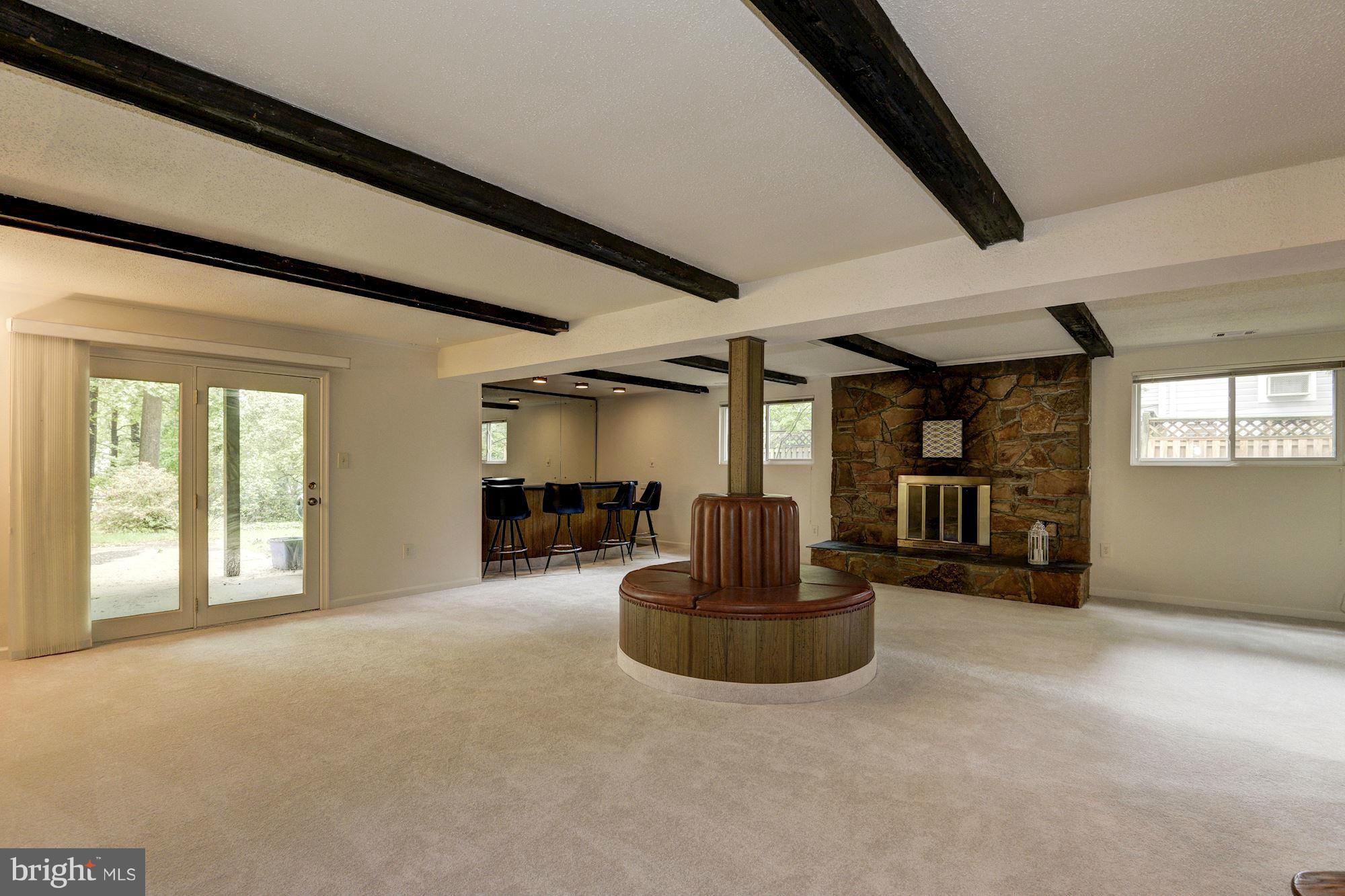 1305 Forestwood Drive McLean, VA 22101 - Photo 22 of 30 a living room with furniture a flat screen tv and a large window