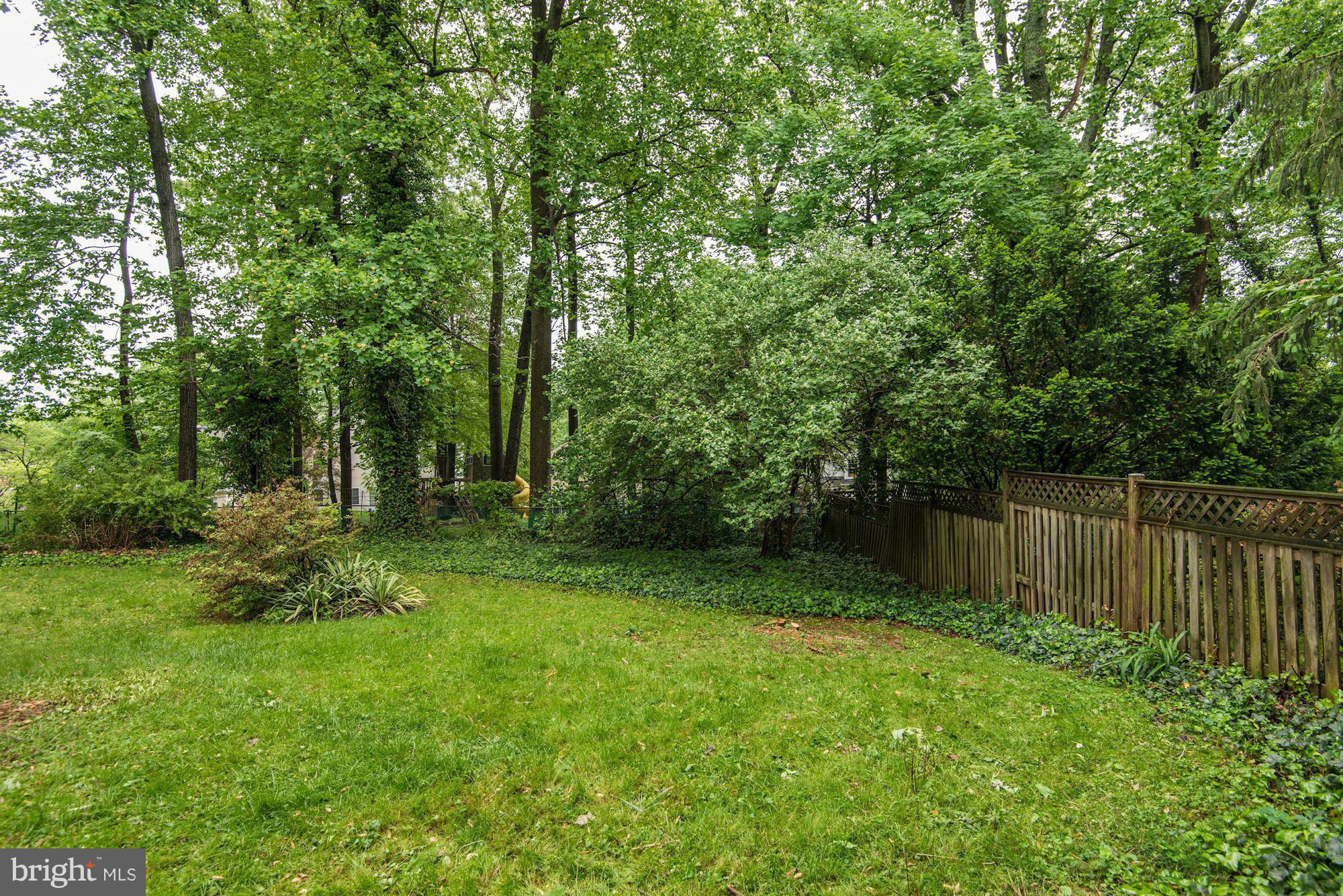 1305 Forestwood Drive McLean, VA 22101 - Photo 28 of 30 a backyard of a house with lots of green space and fountain