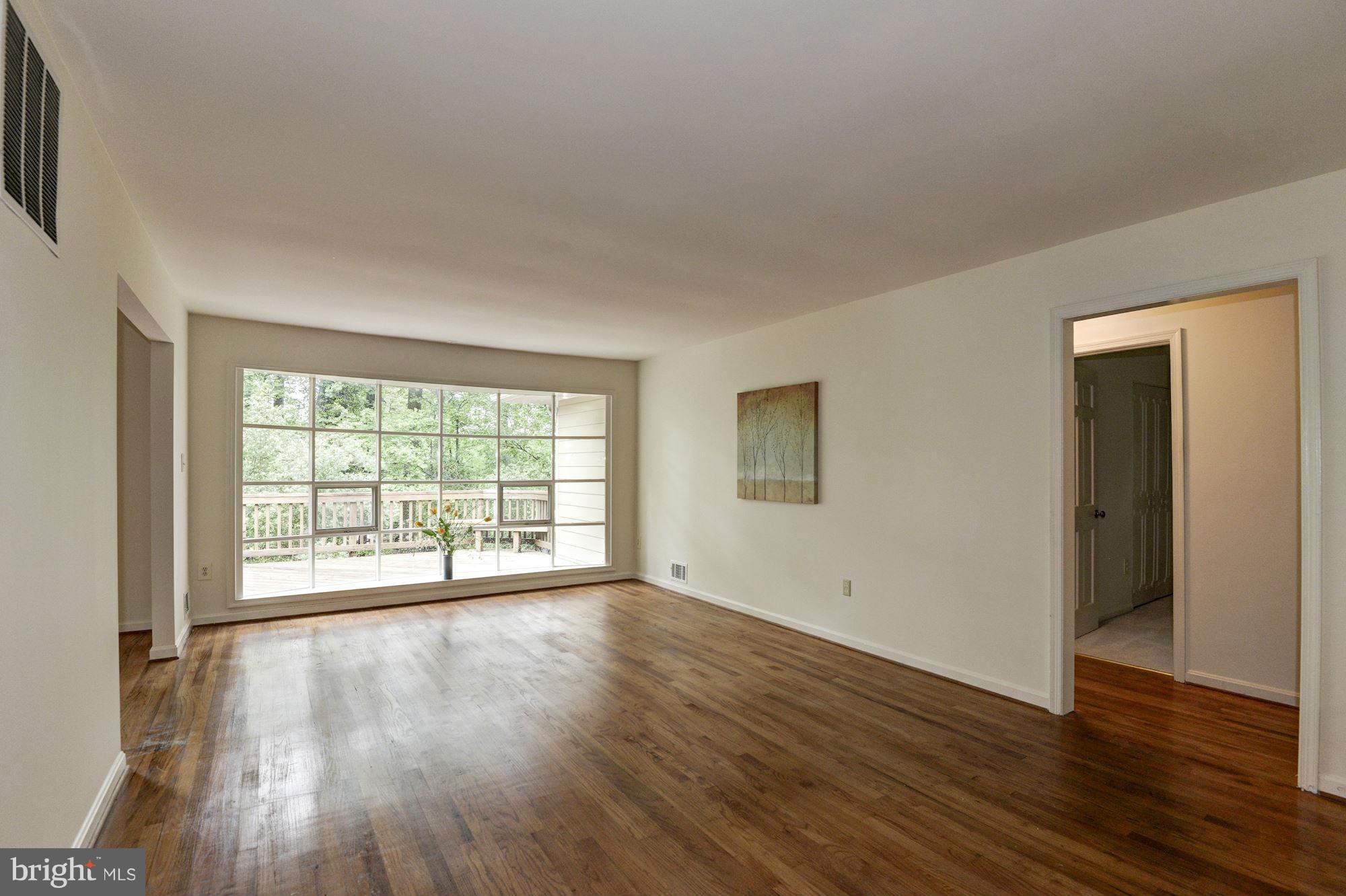1305 Forestwood Drive McLean, VA 22101 - Photo 4 of 30 a view of an empty room with wooden floor and a window