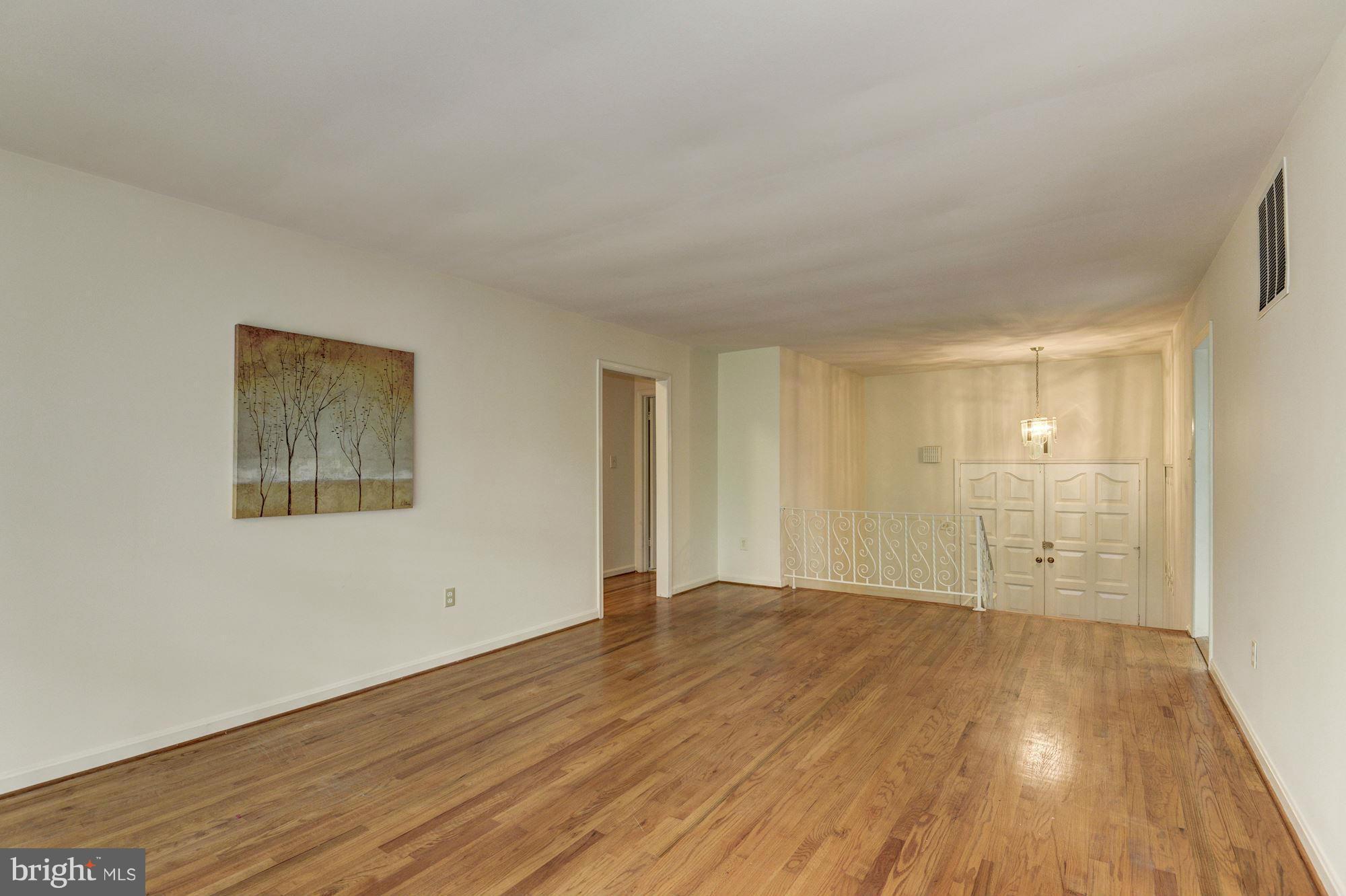 1305 Forestwood Drive McLean, VA 22101 - Photo 7 of 30 a view of an empty room with wooden floor