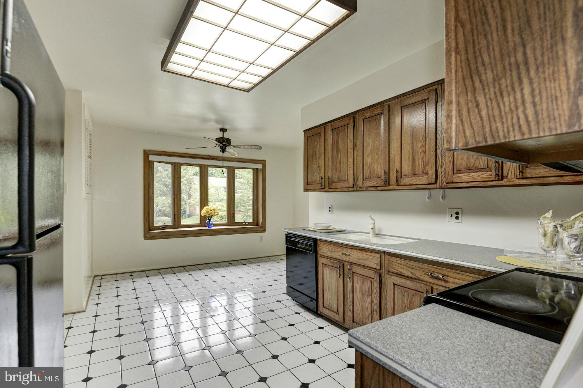 1305 Forestwood Drive McLean, VA 22101 - Photo 10 of 30 a kitchen with stainless steel appliances a sink a stove a refrigerator and cabinets