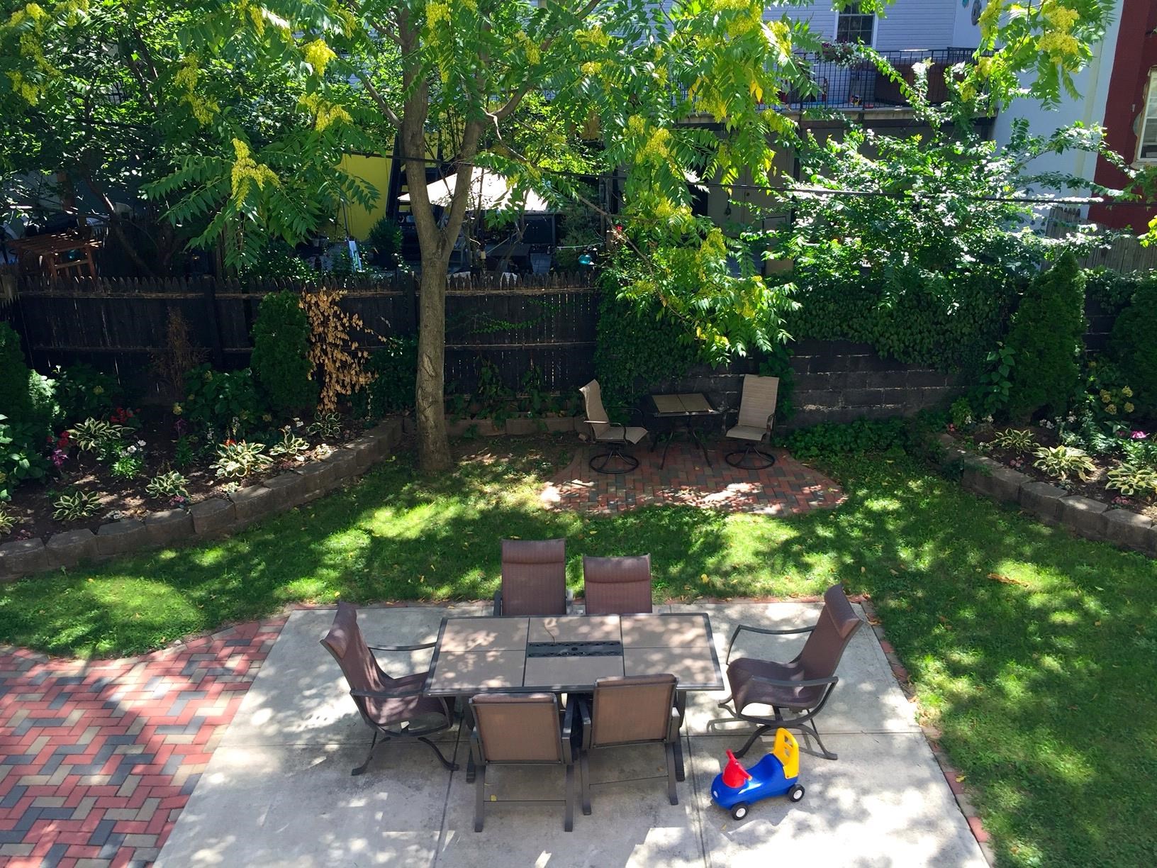 123 Jackson Street, Unit 2B Hoboken, NJ 07030 - Photo 13 of 13 a backyard of a house with seating space