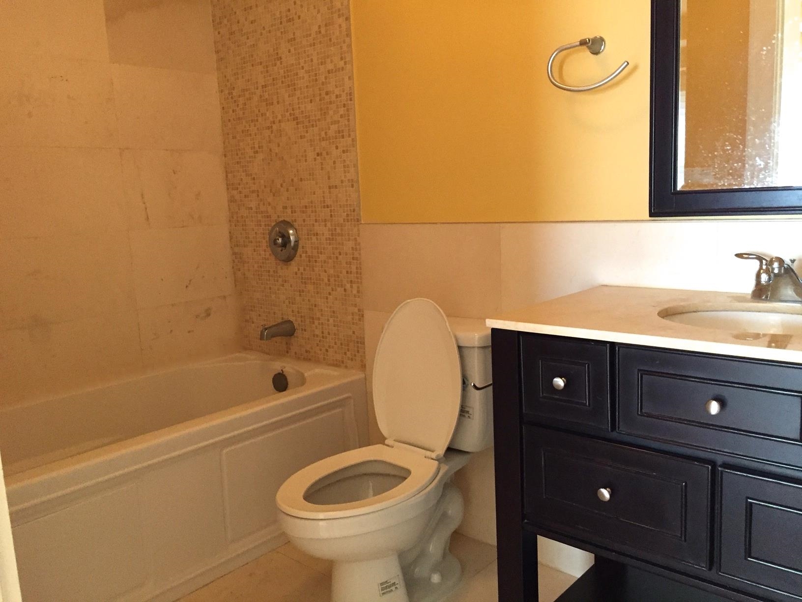 123 Jackson Street, Unit 2B Hoboken, NJ 07030 - Photo 10 of 13 a bathroom with a sink a toilet and bathtub