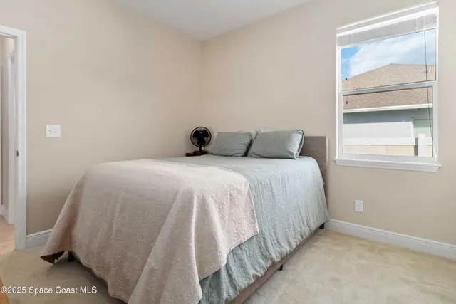 a view of a porch with furniture and garden