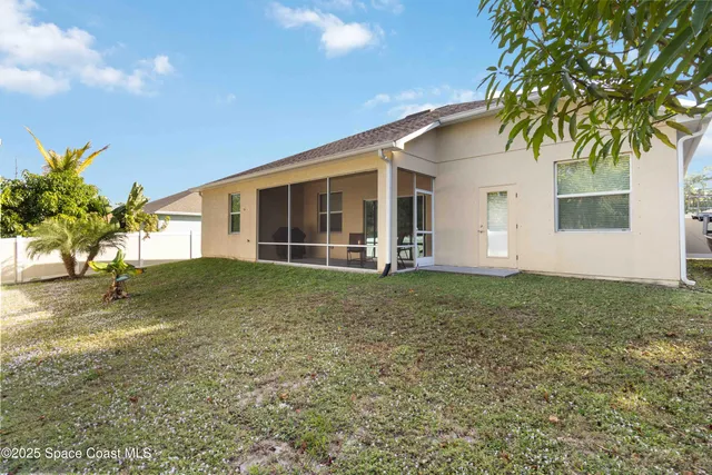an aerial view of residential house with outdoor space