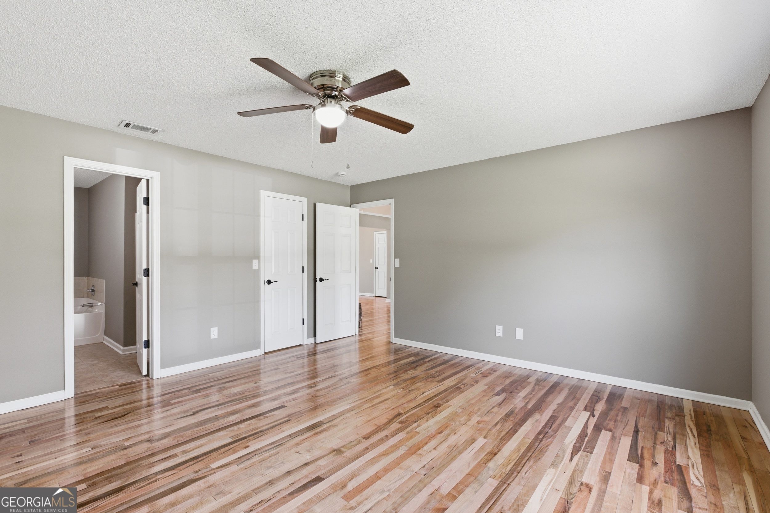 171 Winding Way Hartwell, GA 30643 - Photo 18 of 37 a view of an empty room and wooden floor