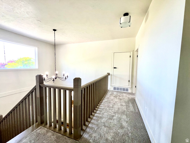 812 East Bates Cyn Road Tooele, UT 84074 - Photo 54 of 144 Upper landing featuring carpet flooring and white walls