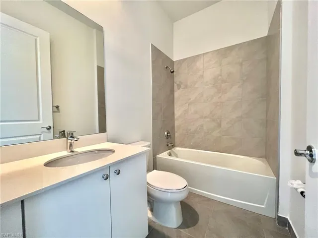 a bathroom with a sink a toilet and a bathtub