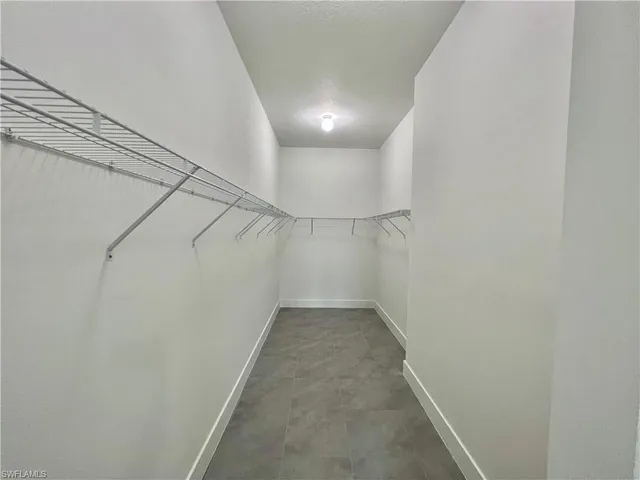 a view of a hallway with a white walls