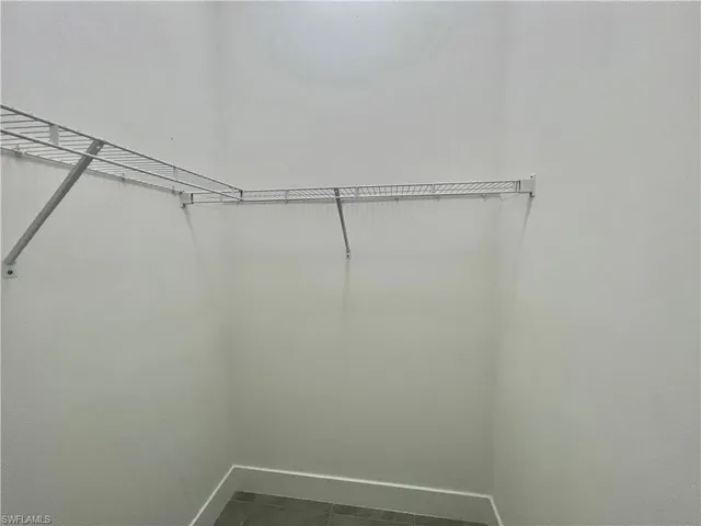 a view of a room with racks on the wall