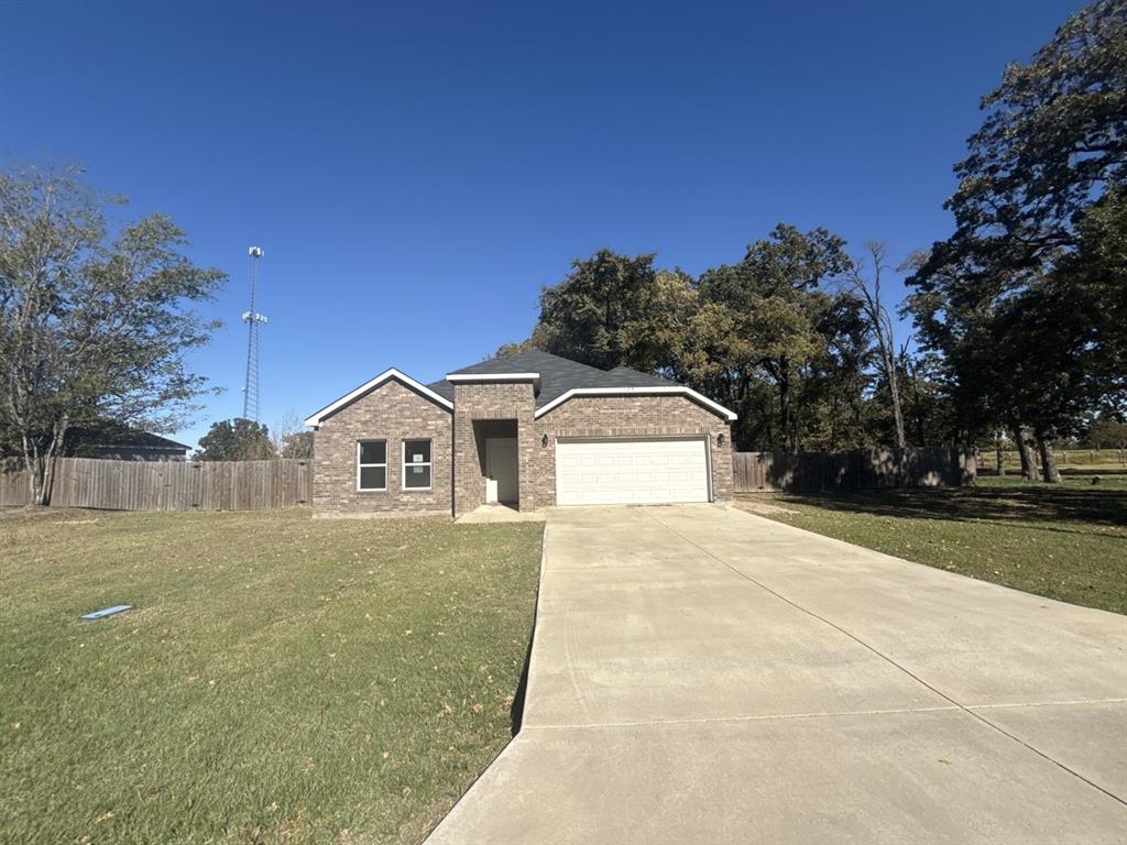 129 Towering Oaks Tool, TX 75143 - Photo 1 of 1 a front view of a house with a yard
