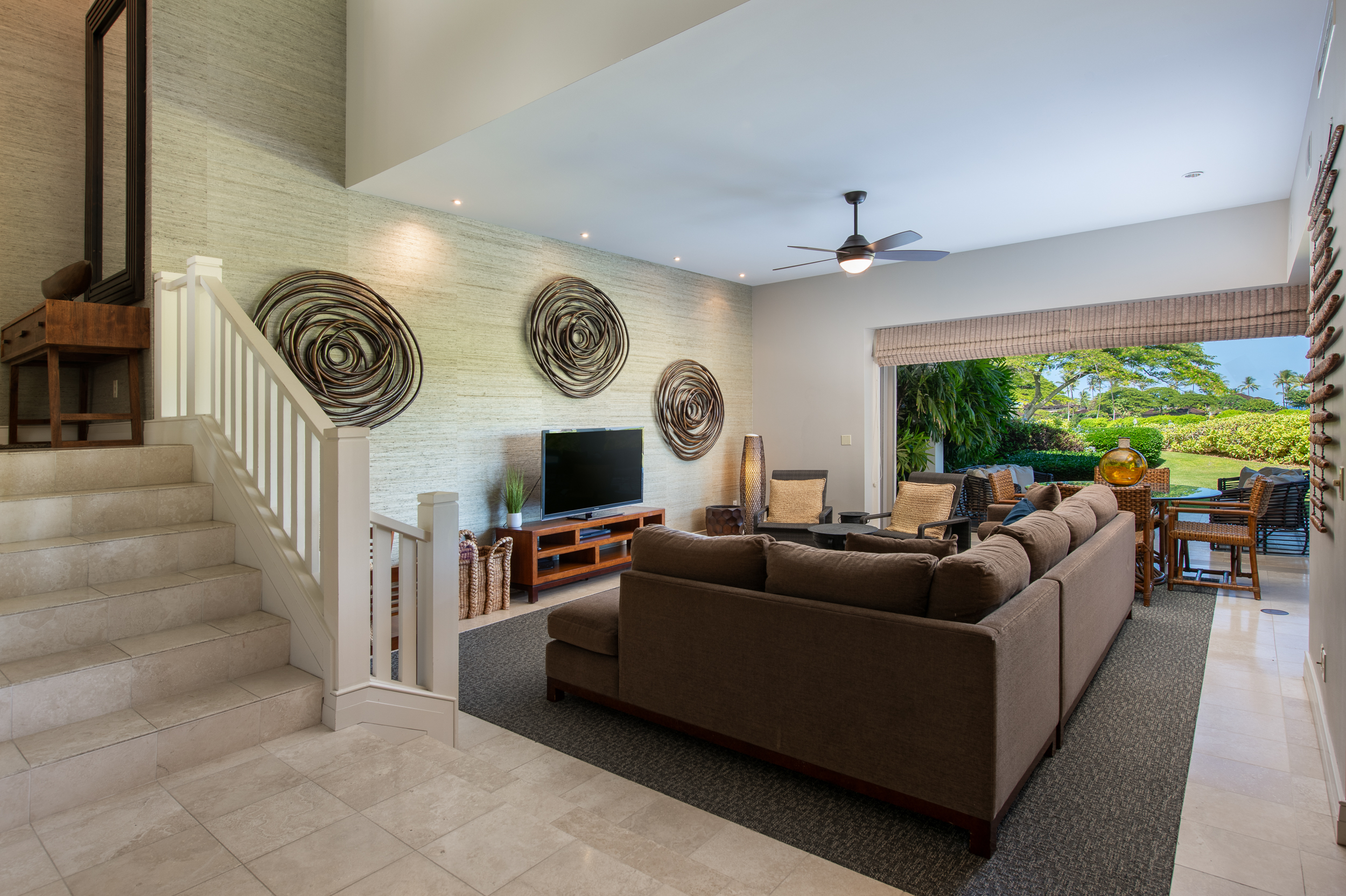 72-140 Waiulu Street, Unit 140B Kailua-Kona, HI 96740 - Photo 12 of 21 a living room with furniture and a clock