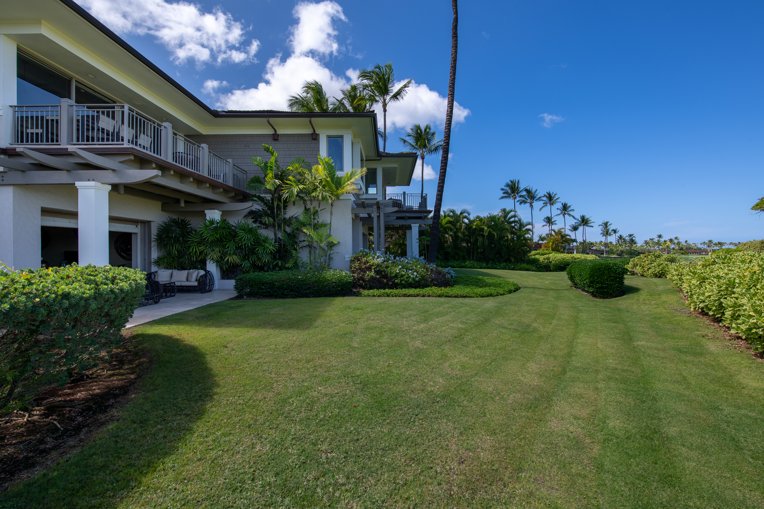 72-140 Waiulu Street, Unit 140B Kailua-Kona, HI 96740 - Photo 15 of 21 a front view of a house with a yard garage and outdoor seating
