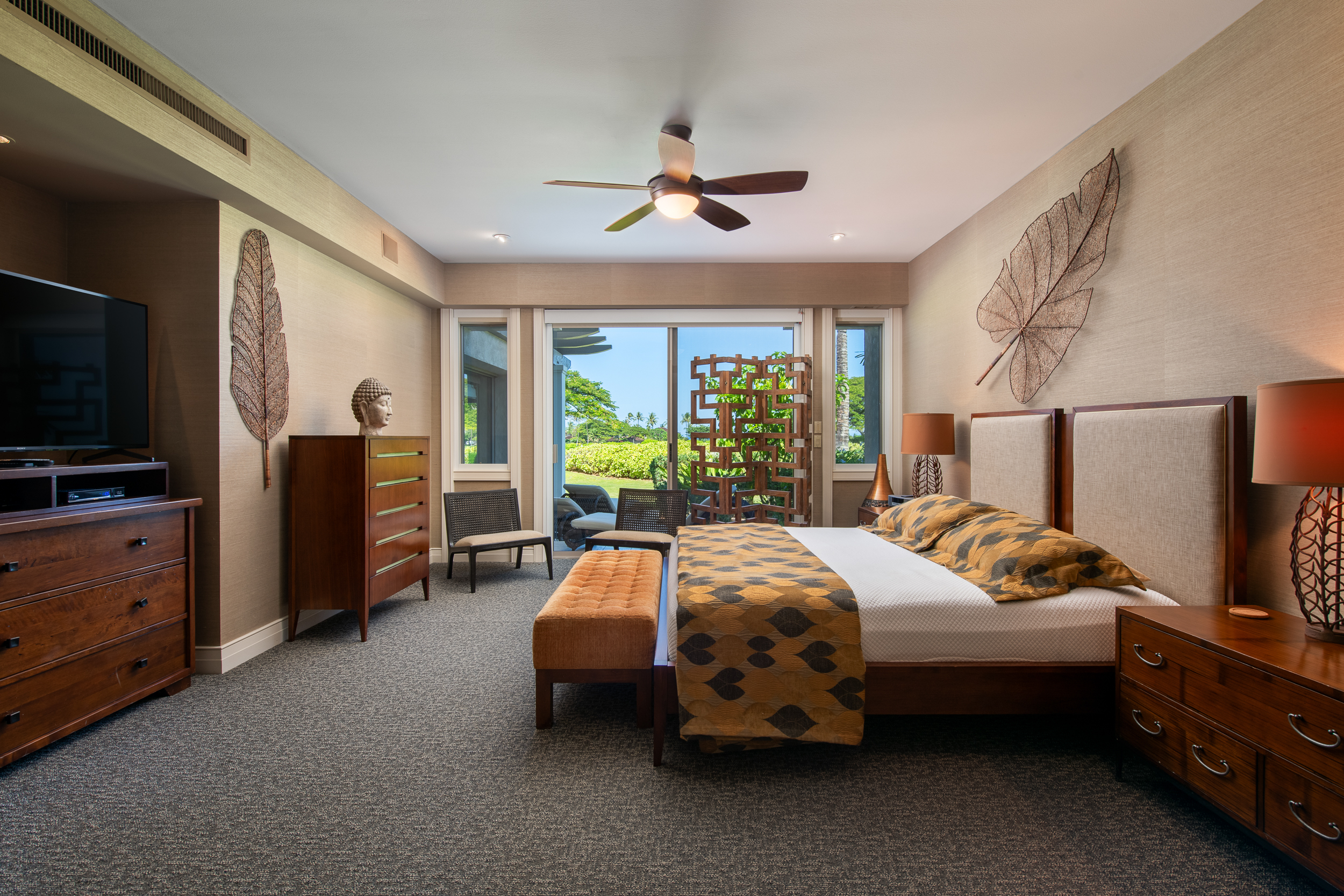 72-140 Waiulu Street, Unit 140B Kailua-Kona, HI 96740 - Photo 16 of 21 a bedroom with bed and a flat tv screen on dresser