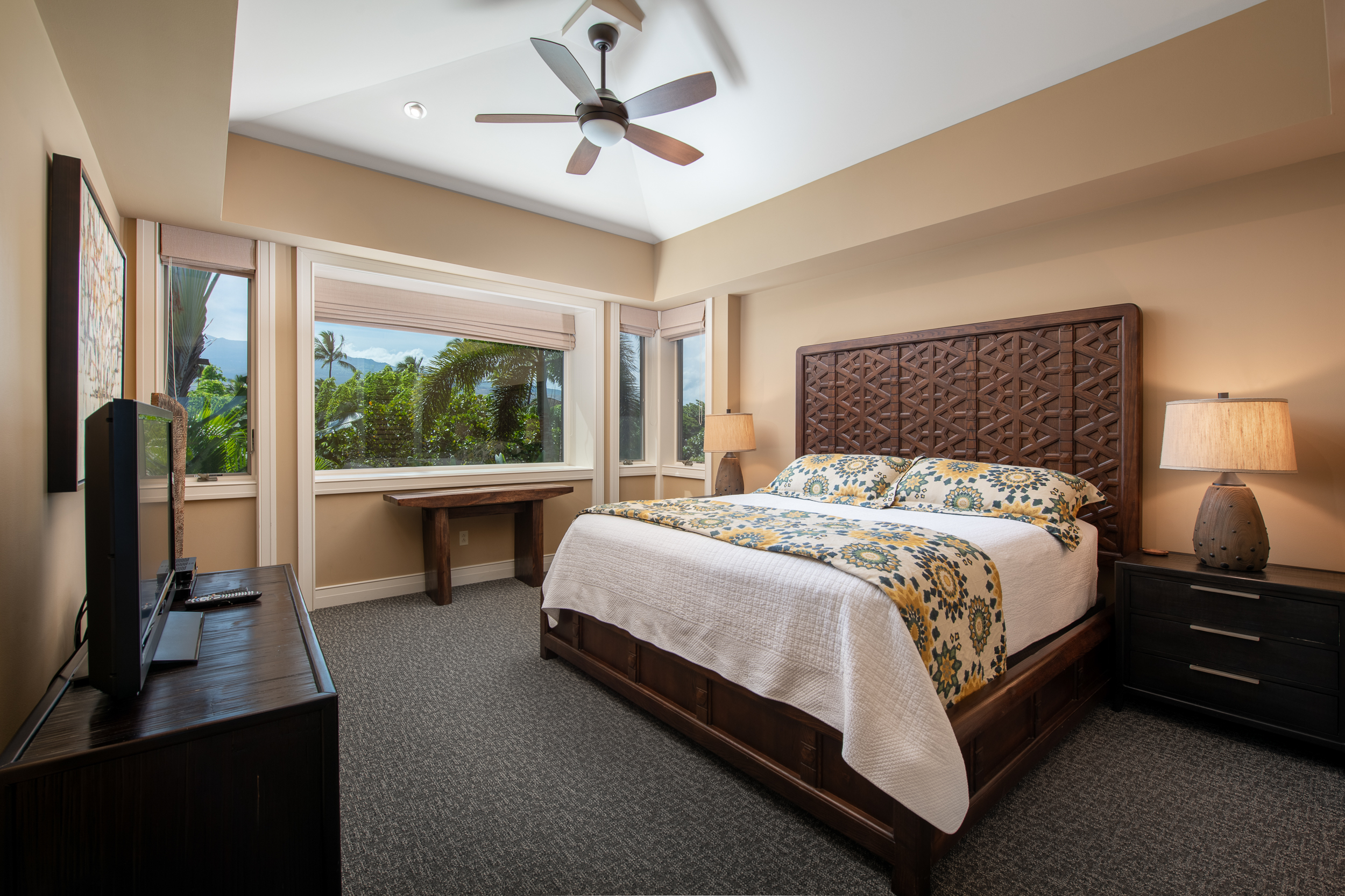 72-140 Waiulu Street, Unit 140B Kailua-Kona, HI 96740 - Photo 18 of 21 a bedroom with a large bed and a large window