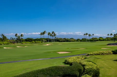 a view of a golf course with a lake
