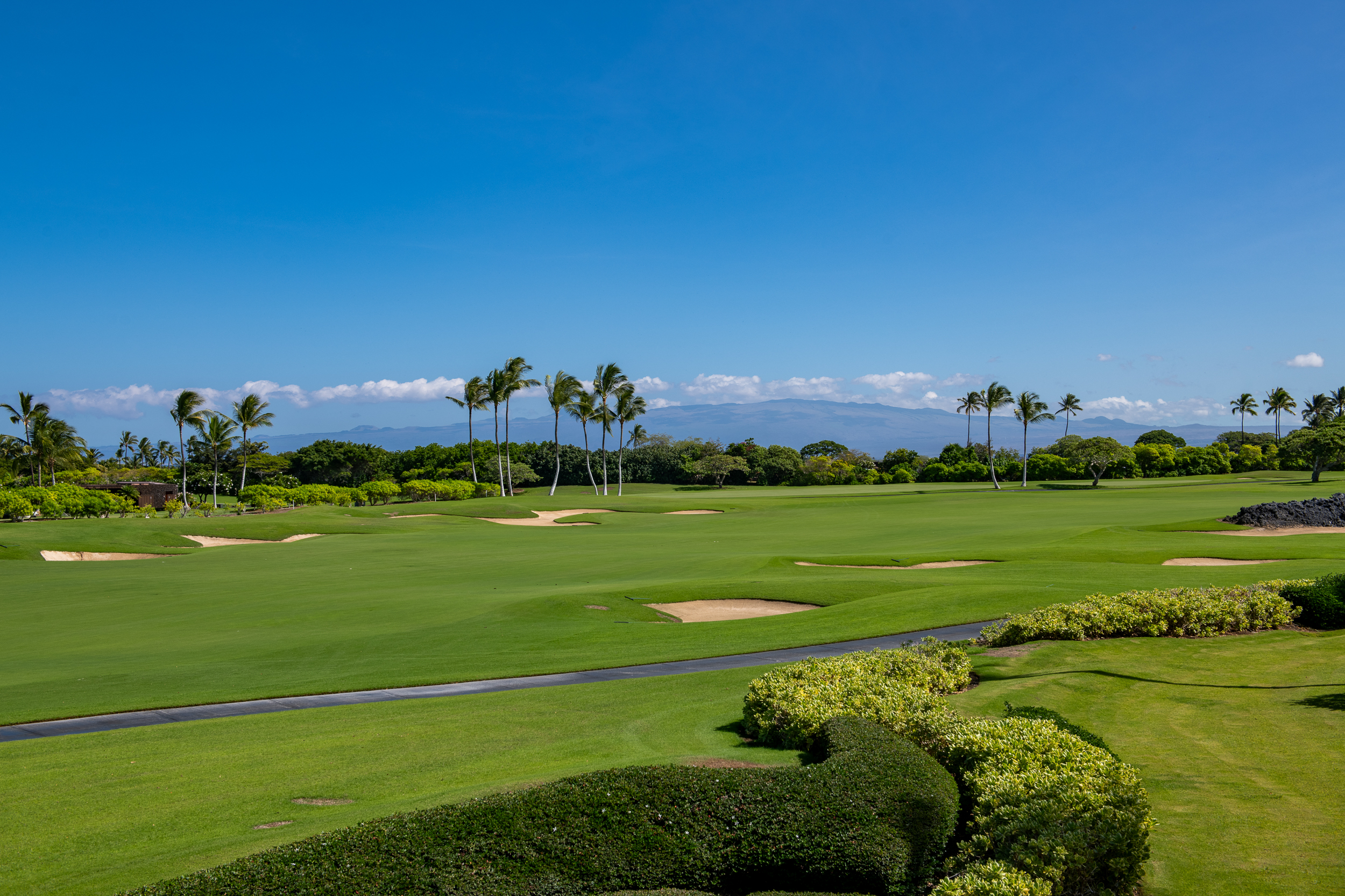 72-140 Waiulu Street, Unit 140B Kailua-Kona, HI 96740 - Photo 3 of 21 a view of a golf course with a lake