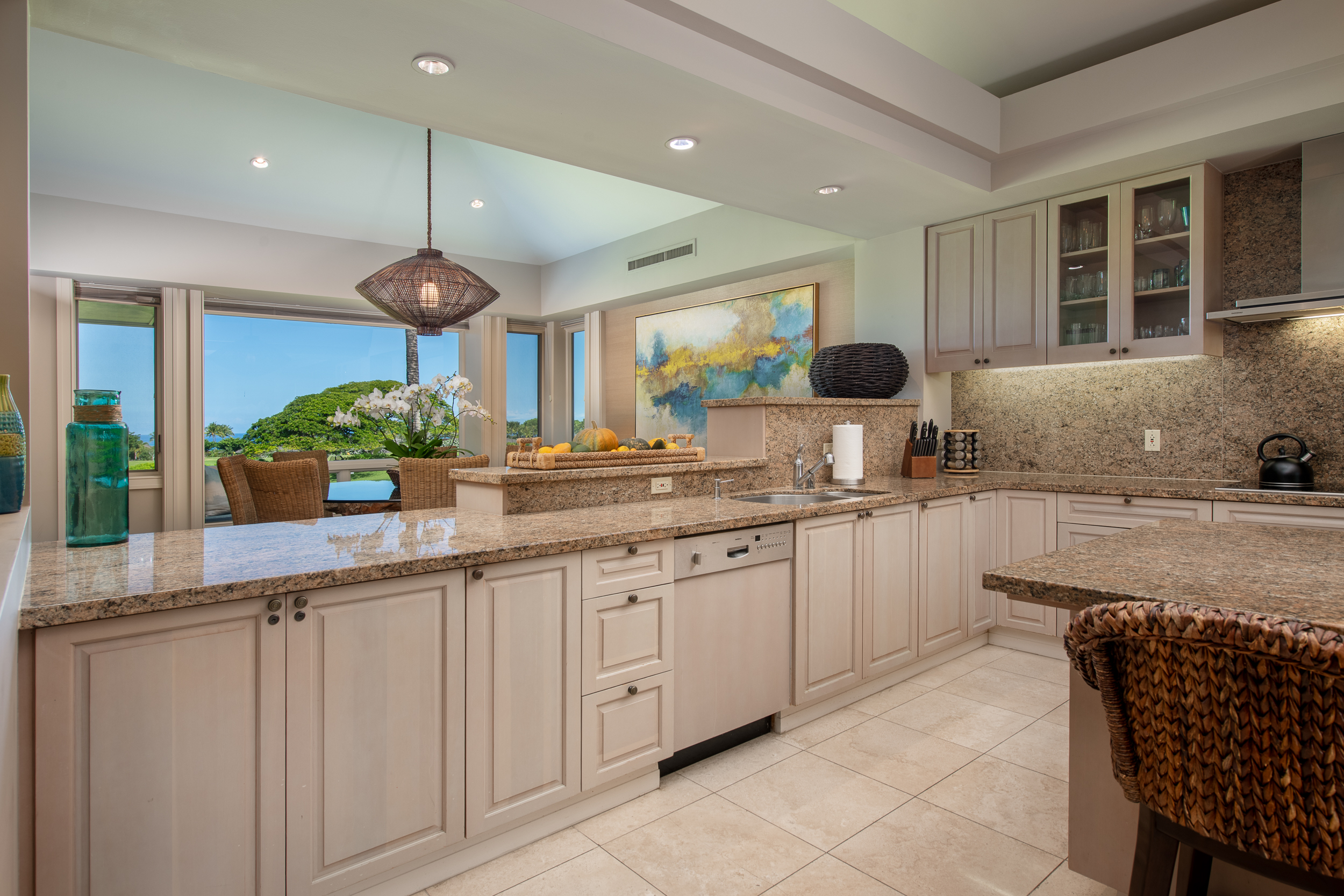 72-140 Waiulu Street, Unit 140B Kailua-Kona, HI 96740 - Photo 8 of 21 a kitchen with stainless steel appliances granite countertop a sink and cabinets