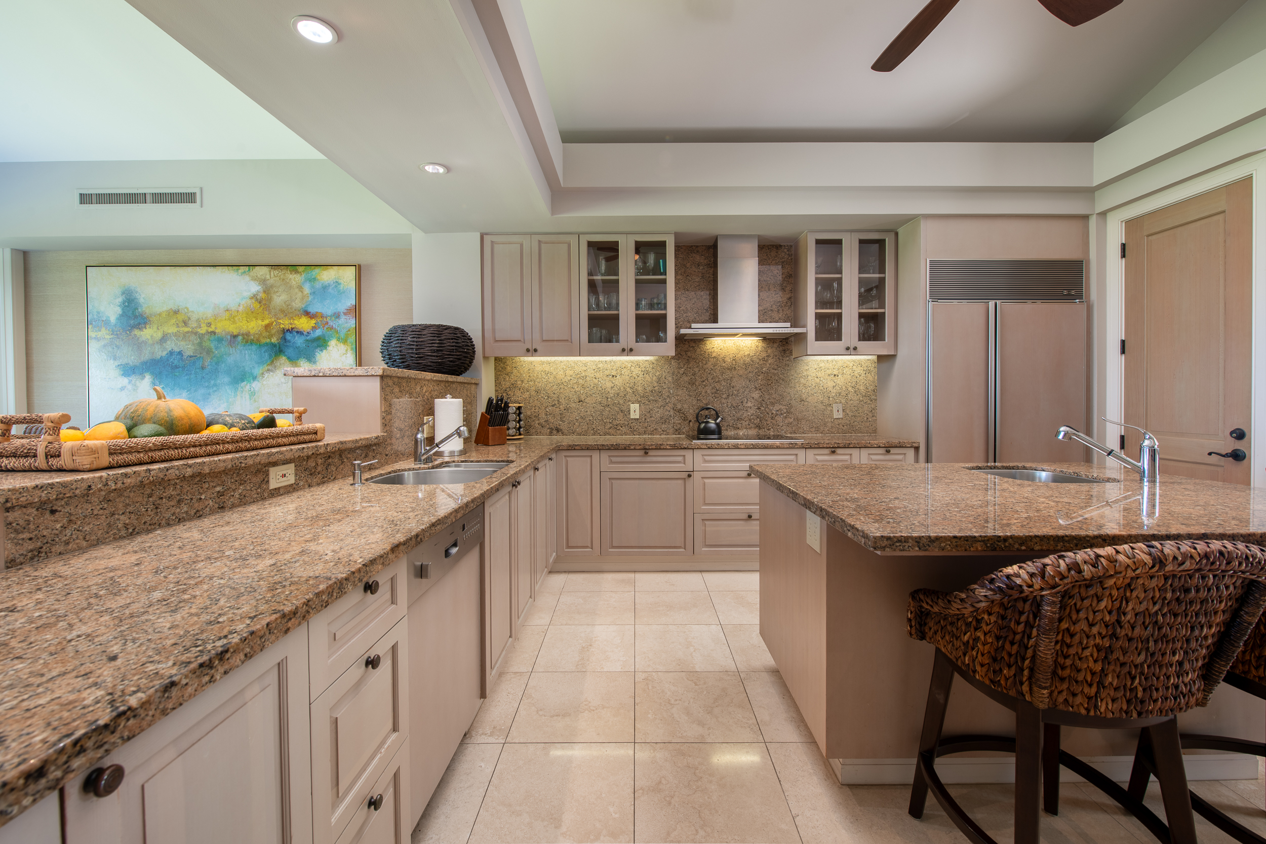 72-140 Waiulu Street, Unit 140B Kailua-Kona, HI 96740 - Photo 9 of 21 a large kitchen with granite countertop a sink and a refrigerator