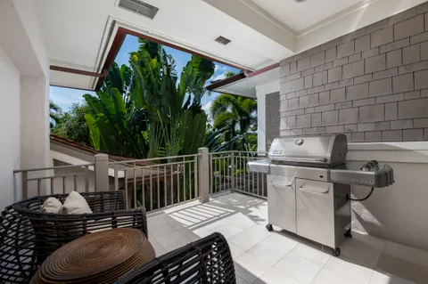 a table and chairs sitting in front of a house