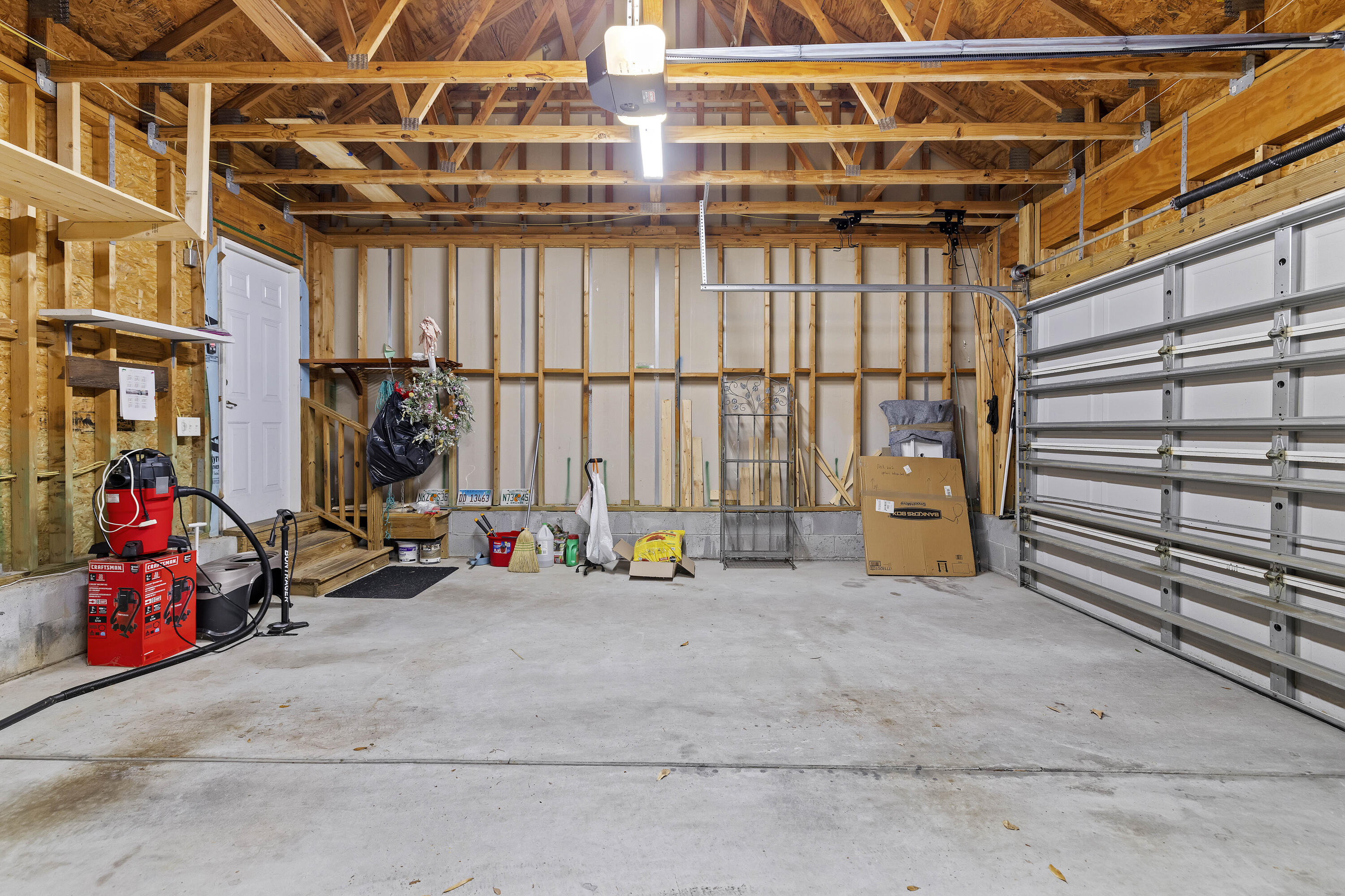 1772 Tennyson Row Mount Pleasant, SC 29466 - Photo 22 of 25 TWO CAR GARAGE WITH BUILT IN SHELVES