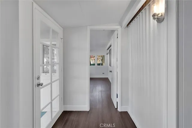 a view of an entryway with wooden floor