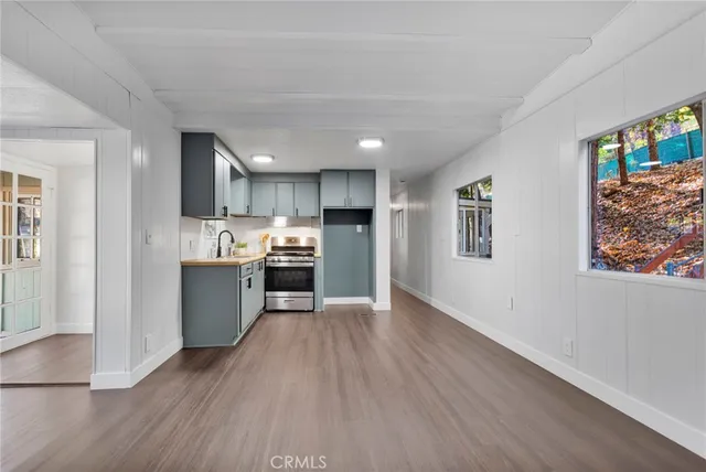 a view of kitchen with wooden floor