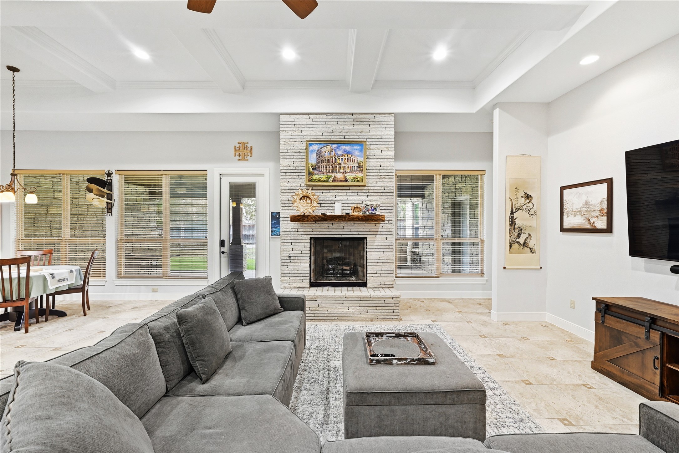 140 Winchester Road Bastrop, TX 78602 - Photo 12 of 36 Living area with a ceiling fan, beam ceiling, a fireplace, and recessed lighting