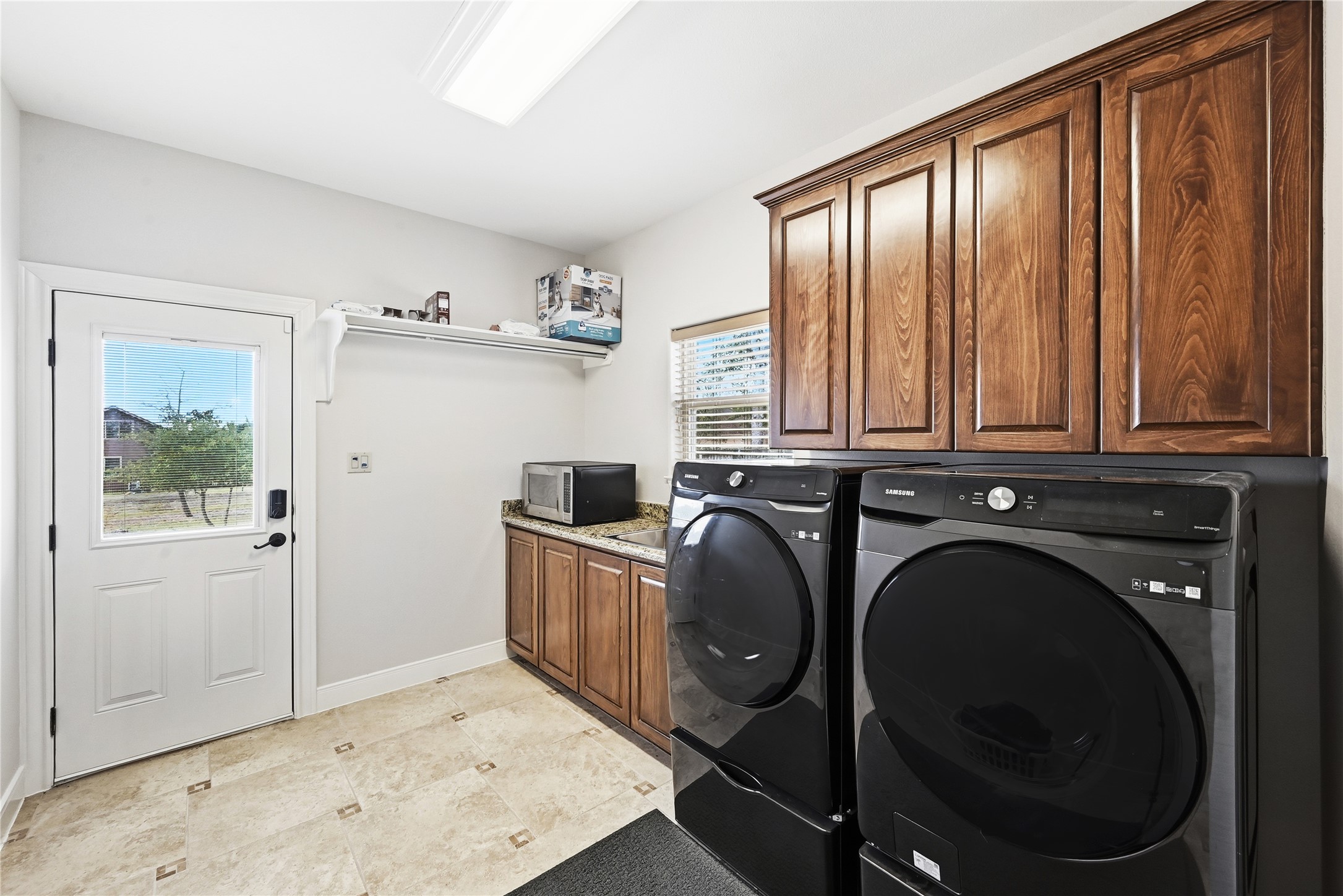 140 Winchester Road Bastrop, TX 78602 - Photo 30 of 36 Laundry area featuring cabinet space and separate washer and dryer