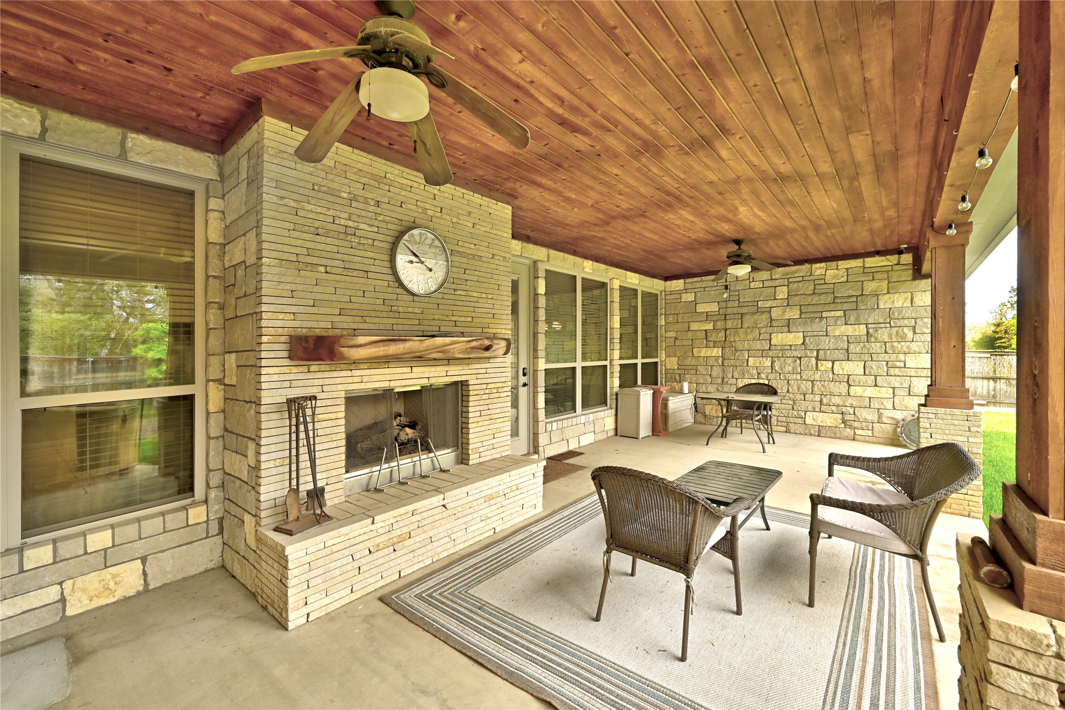 140 Winchester Road Bastrop, TX 78602 - Photo 33 of 36 View of patio / terrace featuring a ceiling fan and an outdoor living space with a fireplace