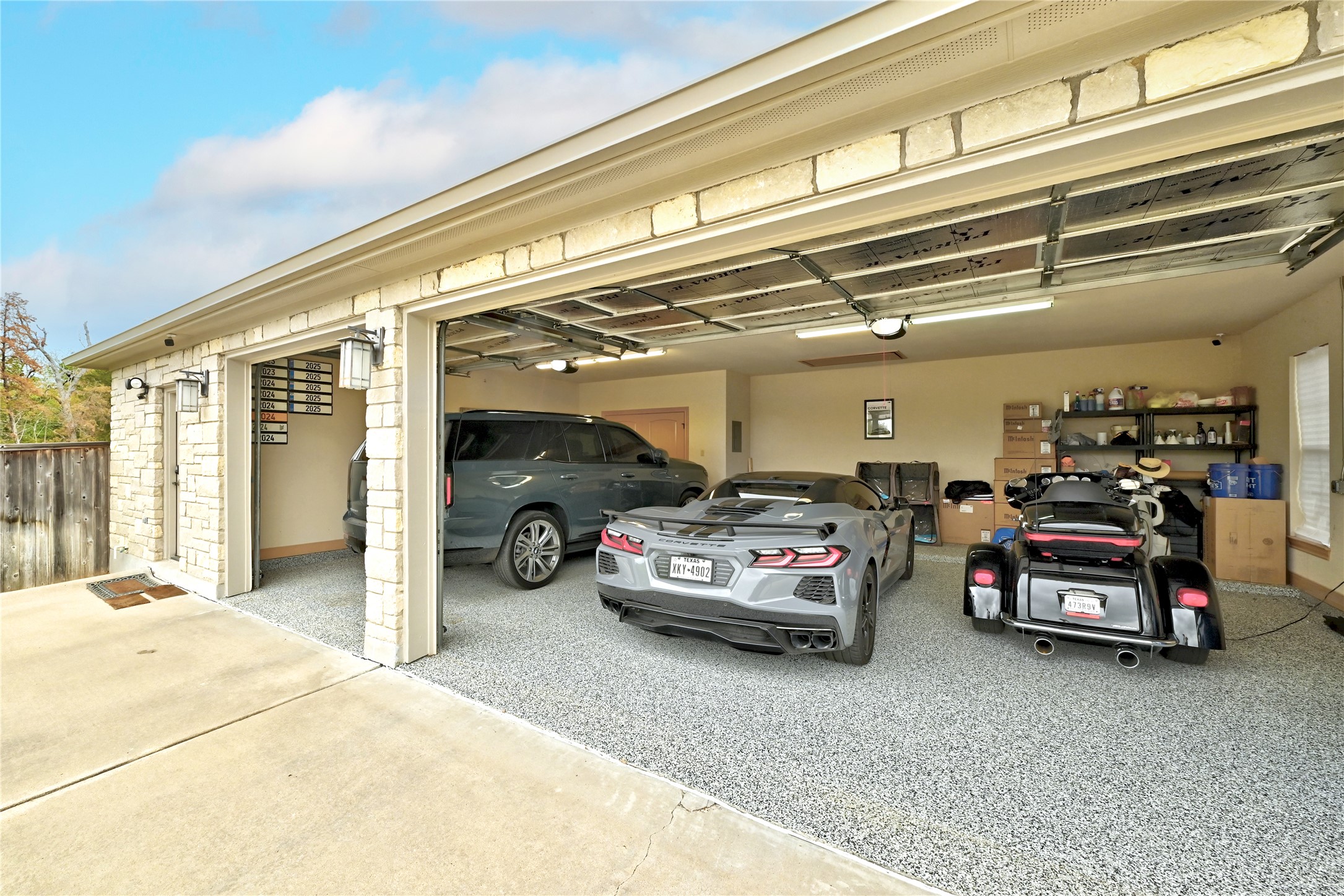140 Winchester Road Bastrop, TX 78602 - Photo 34 of 36 Spacious 3 car garage with outdoor concrete coating