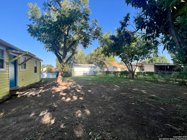 a backyard of a house with lots of green space