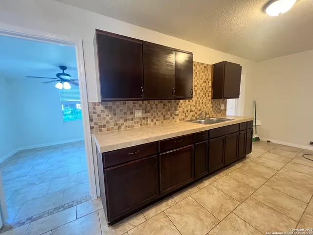a bathroom with a double vanity sink and mirror