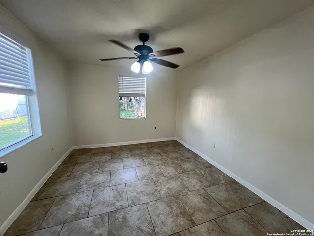 a view of an empty room and window