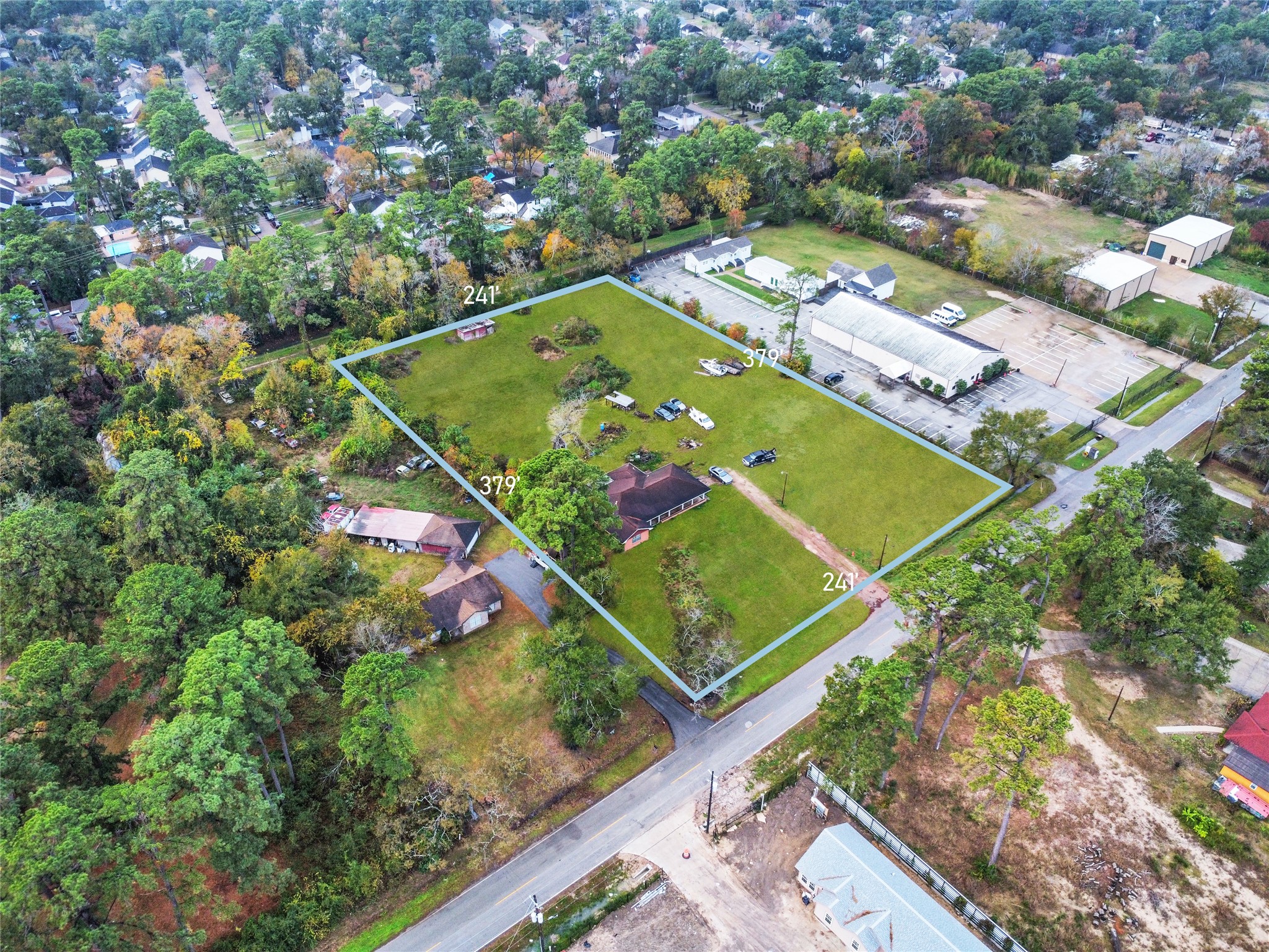 17419 Bamwood Road Houston, TX 77090 - Photo 3 of 12 an aerial view of a tennis ground and a large tree