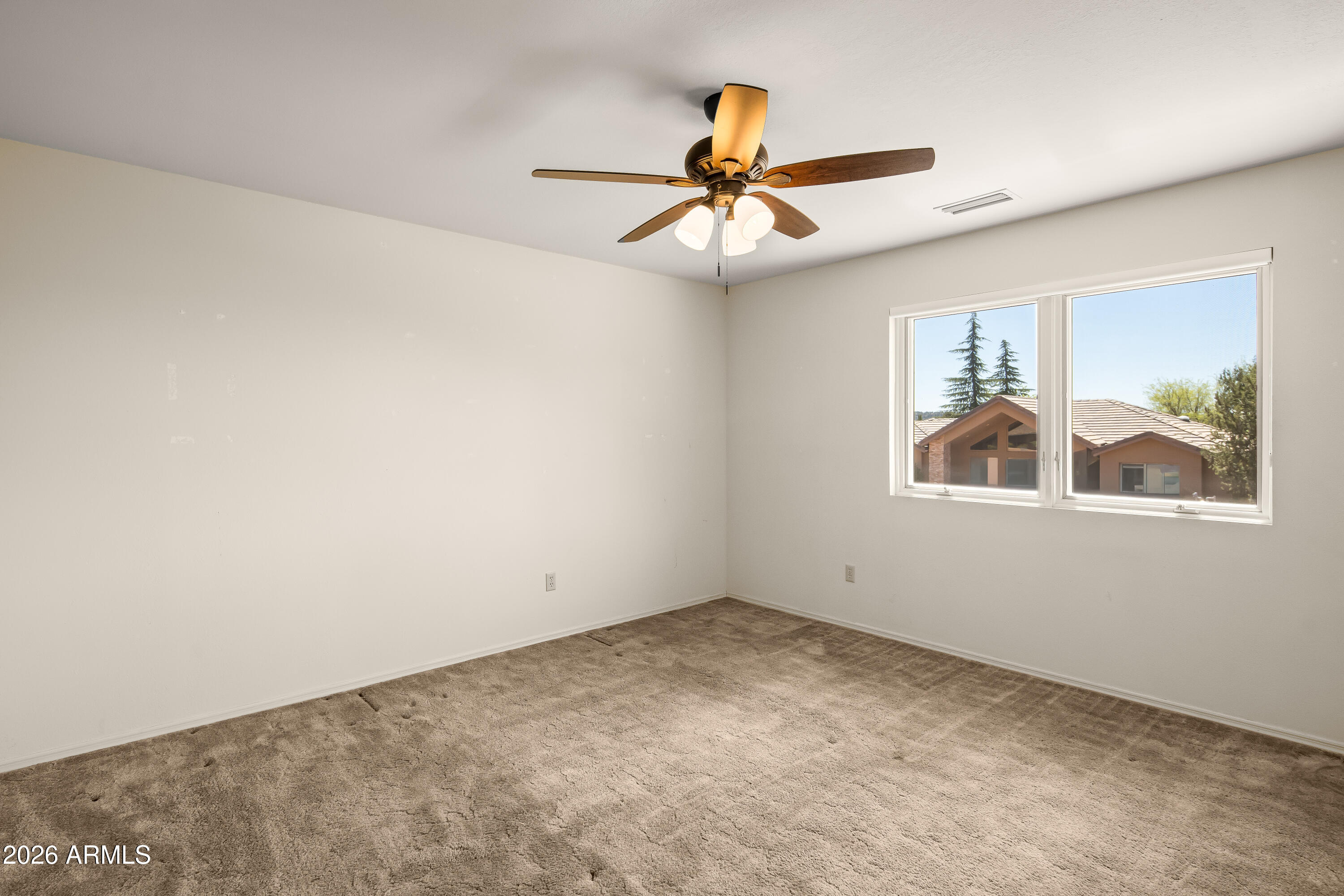 2320 Buckboard Road Sedona, AZ 86336 - Photo 16 of 19 an empty room with window and ceiling fan
