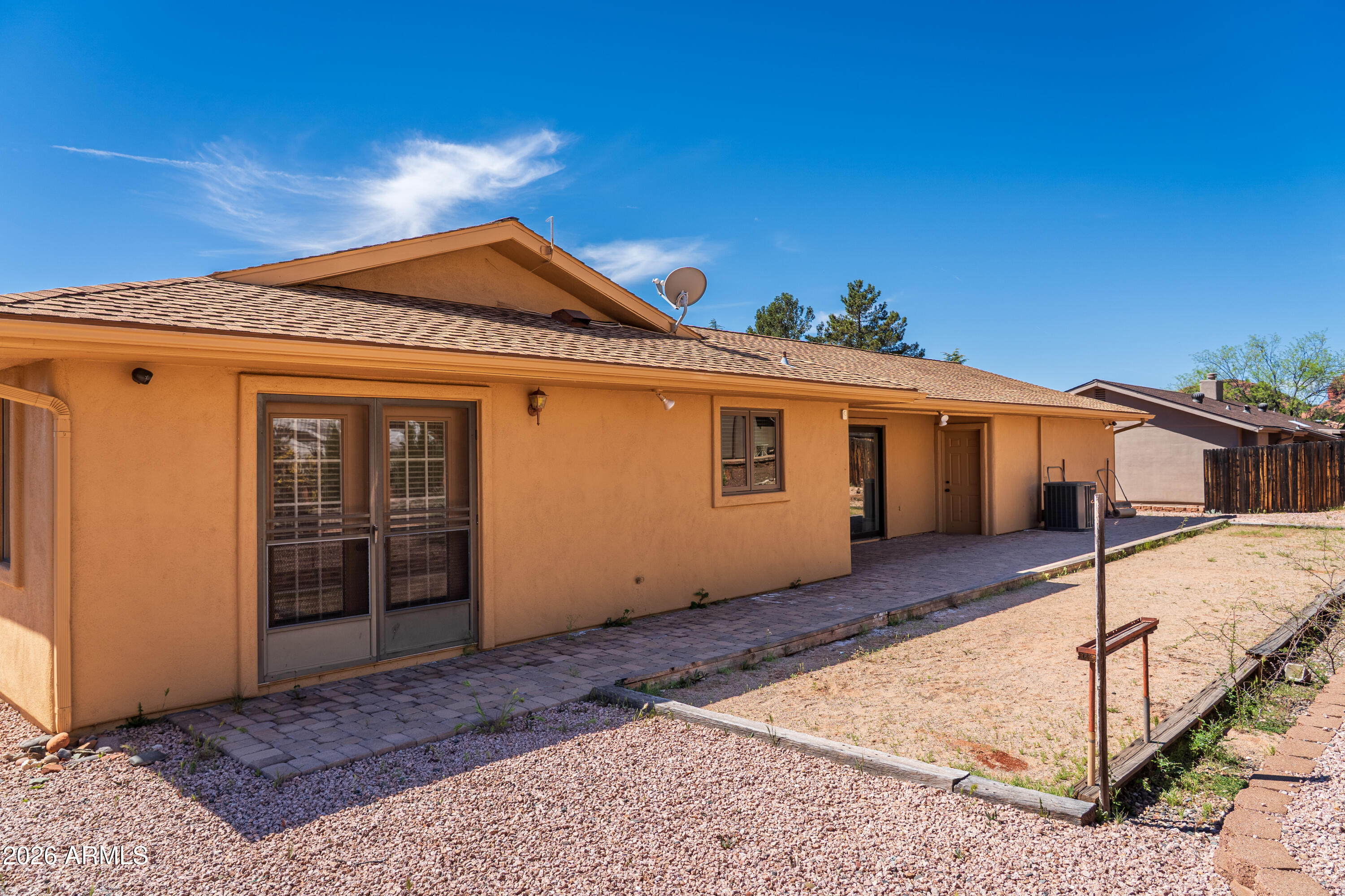 2320 Buckboard Road Sedona, AZ 86336 - Photo 18 of 19 a front view of a house with a yard