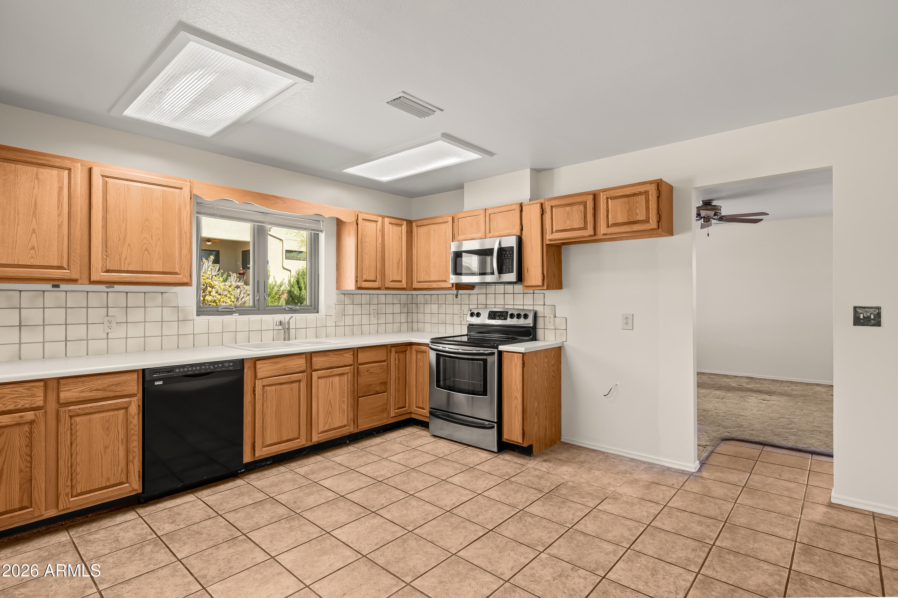 2320 Buckboard Road Sedona, AZ 86336 - Photo 8 of 19 a kitchen with a sink cabinets and window