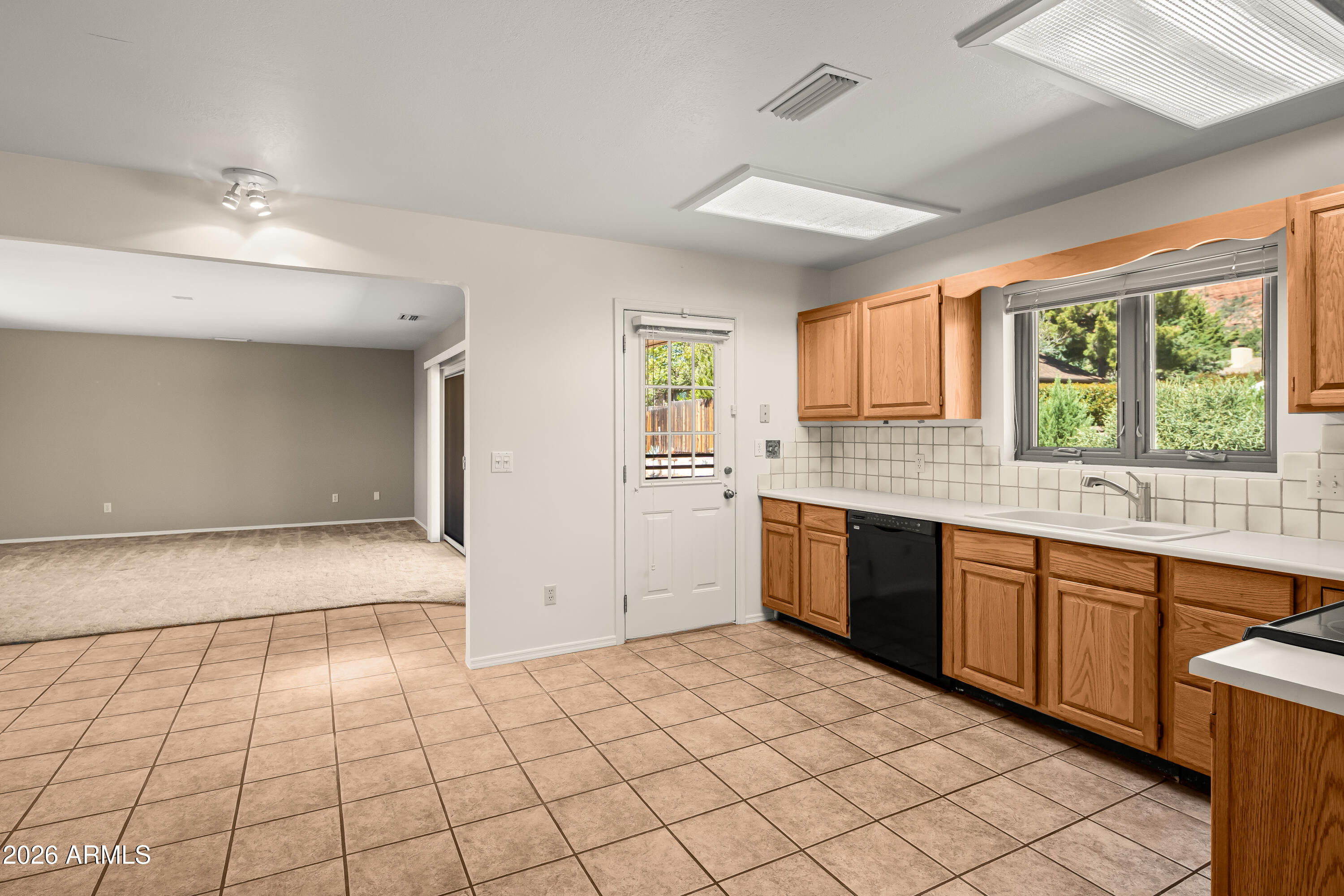 2320 Buckboard Road Sedona, AZ 86336 - Photo 10 of 19 a large kitchen with stainless steel appliances granite countertop a stove a sink and a granite counter tops
