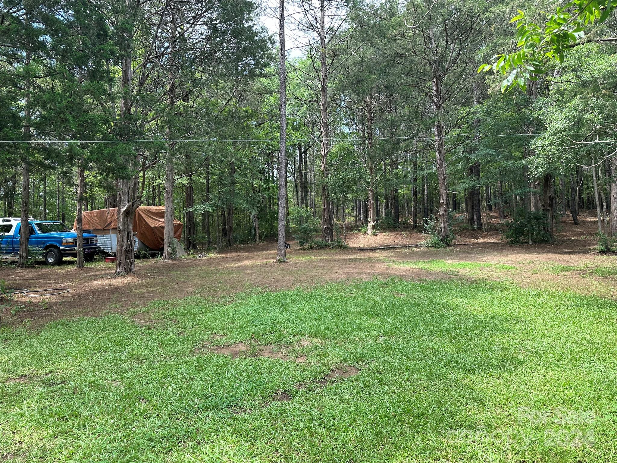 806 Pinckney Road Chester, SC 29706 - Photo 4 of 6 a backyard of a house with table and chairs