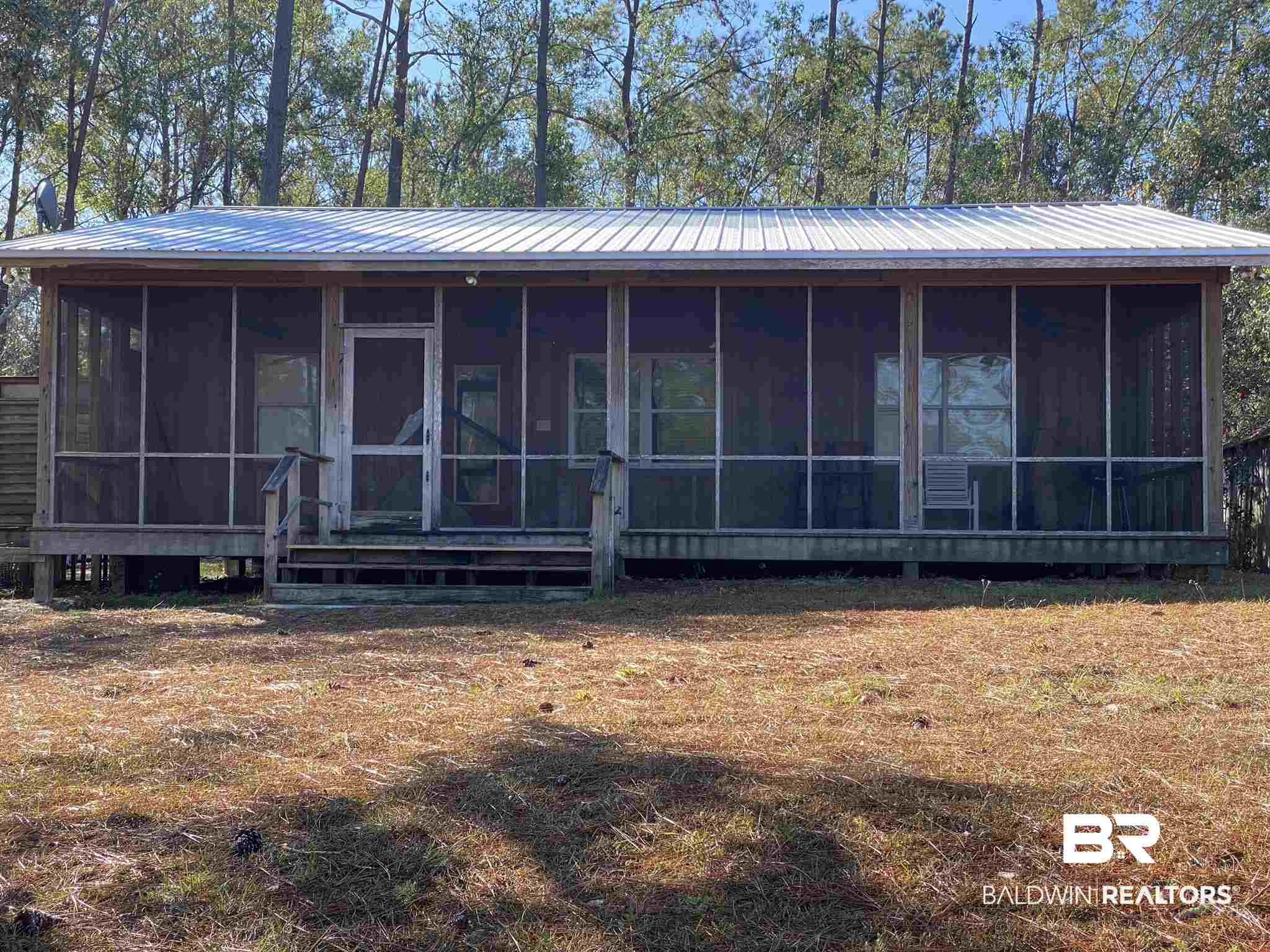 18765 Pine Acres Road Gulf Shores, AL 36542 - Photo 2 of 47 This is the front of house overlooking the river.