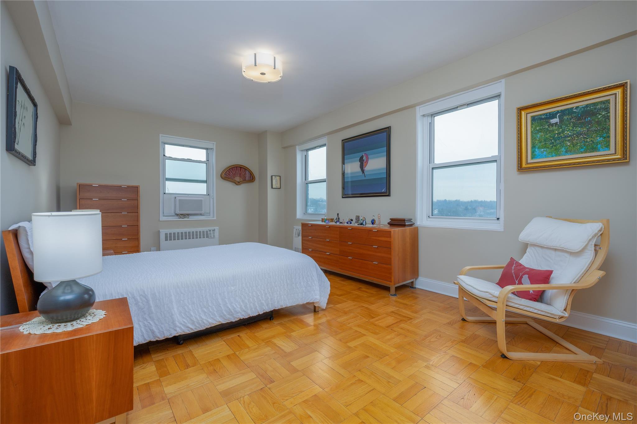 900 Palmer Road, Unit 9J Bronxville, NY 10708 - Photo 7 of 14 a bedroom with a bed and wooden floor