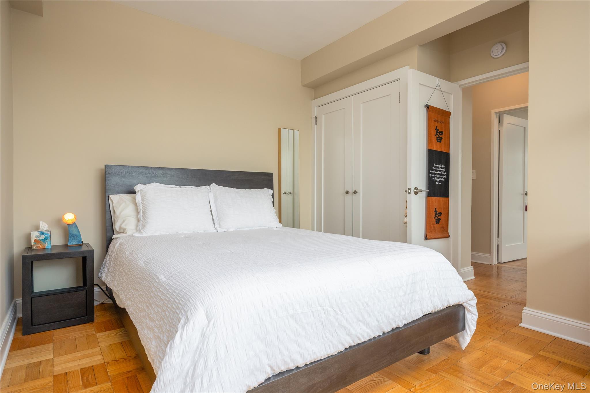 900 Palmer Road, Unit 9J Bronxville, NY 10708 - Photo 8 of 14 a bedroom with a bed and a night stand